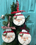 Hand-painted Santa Believe bulb-shaped wood ornament with holly detail