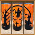 Orange 20oz skinny epoxy tumbler with black Halloween haunted graveyard silhouettes