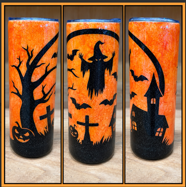 Orange 20oz skinny epoxy tumbler with black Halloween haunted graveyard silhouettes