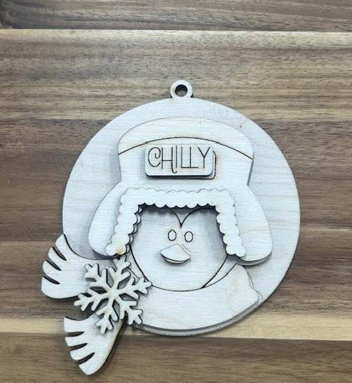 Unfinished layered snowman ornament with Chilly winter hat, scarf, snowflake, and hanging loop.