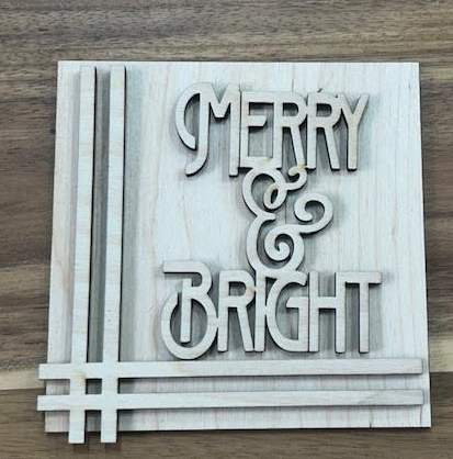 Unfinished Merry and Bright wood frame insert with layered lettering and intersecting border stripes.