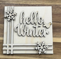 Unfinished Hello Winter wood frame insert with two snowflakes, a small bird, and intersecting stripe accents