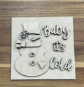 Unfinished Baby It's Cold wood frame insert with a snowman, top hat, scarf, buttons, heart, and lettering