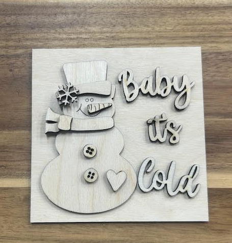 Unfinished Baby It's Cold wood frame insert with a snowman, top hat, scarf, buttons, heart, and lettering