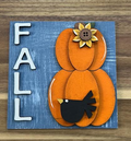 Finished Fall insert with two orange pumpkins, yellow flower, black bird, and cream lettering on distressed blue background