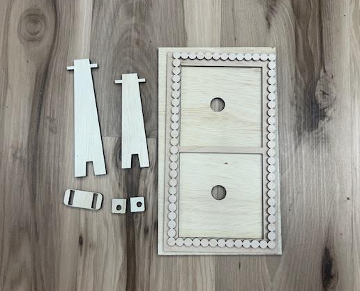 Unfinished double wood frame with scalloped border, two stands, and small assembly pieces