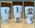 White 30oz regular epoxy tumbler with a bundled gnome and Sweater Weather design