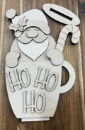 Unfinished Santa mug shelf sitter wood blank with Ho Ho Ho lettering, candy cane, holly, and separate oval base