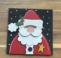 Hand-painted Santa frame insert with a red hat and coat, white beard, holly, and a gold star on a black snowy background