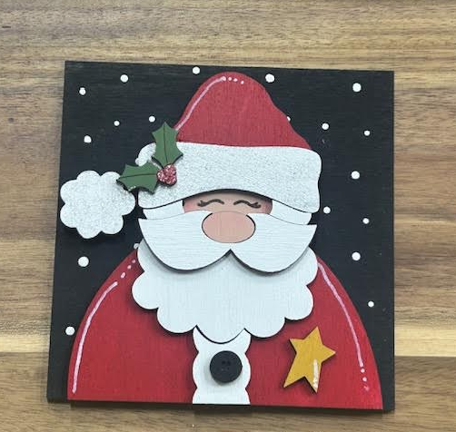 Hand-painted Santa frame insert with a red hat and coat, white beard, holly, and a gold star on a black snowy background
