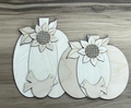 Unfinished wood shelf sitter featuring two pumpkins with sunflower and bird details