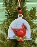 Hand-painted red cardinal ornament with Always with you wording, a blue dome, and festive greenery.