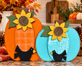 Finished orange and turquoise pumpkin shelf sitter with yellow sunflowers, green leaves, and black birds