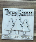 Unfinished Tree Farm wood frame insert with layered evergreen trees, Tree Farm lettering, and Cedar Pine Spruce banner.