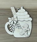 Unfinished birch gingerbread hot cocoa mug ornament blank with whipped cream, striped straw, bow, and greenery