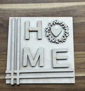 Unfinished HOME birch frame insert with a heart-centered leafy wreath replacing the O and line accents along the left and bottom.