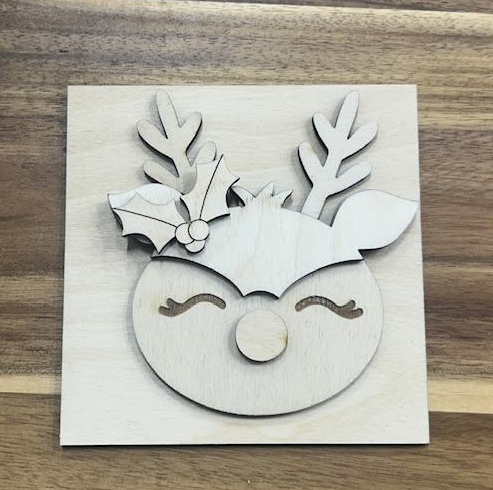 Unfinished reindeer frame insert wood blank with antlers, holly, closed eyes, and a round nose