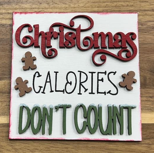 Hand-painted Christmas Calories Don't Count frame insert with red and green lettering and gingerbread figures